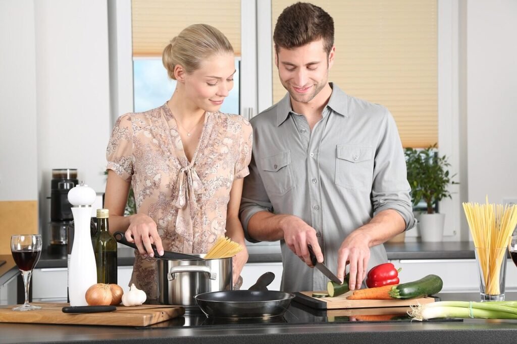 happy valentines day, woman, man, kitchen, food preparation, couple, relationship, together, cooking, pair, cutting, chopping, everyday life, blonde, cutting board, vegetables, happy couple, stove, cook, knife, noodles