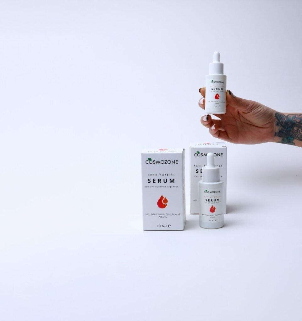 a hand holding a bottle of medicine