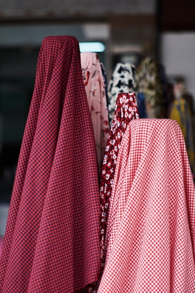 a red and white checkered cloth hanging on a rack