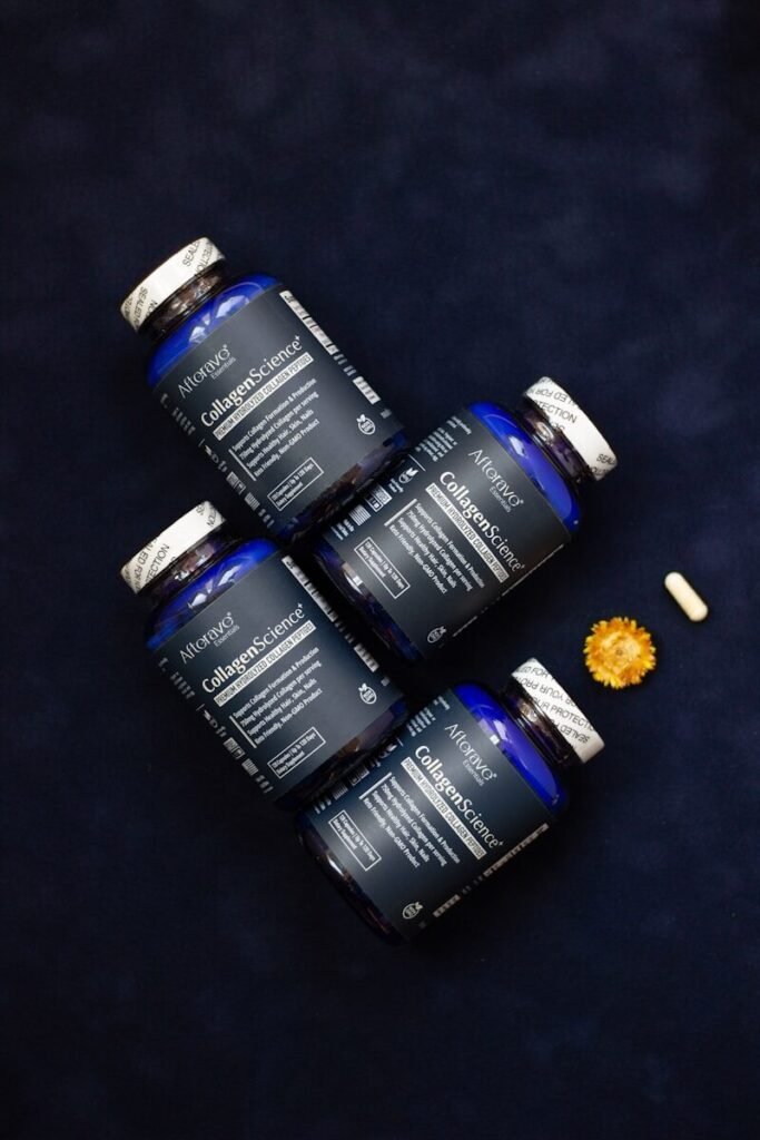 Four bottles of vitamins sitting on top of a table